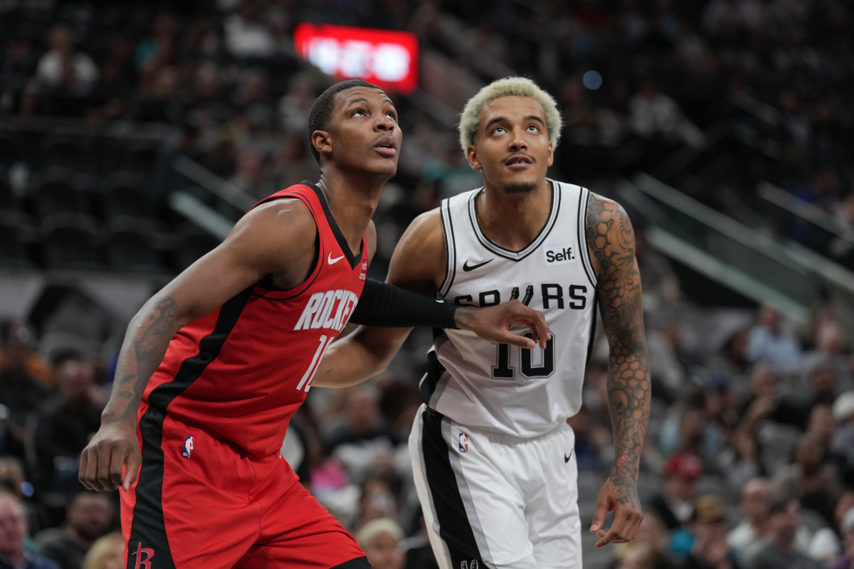 Oct 18, 2023; San Antonio, Texas, USA; Houston Rockets center Jock Landale (11) and San Antonio Spurs forward Jeremy Sochan (10) look for a rebound in the first half at the Frost Bank Center. 